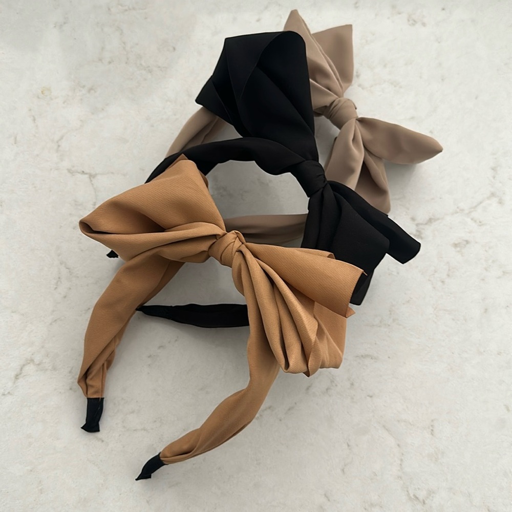 3 women’s headbands with bows. Black. Tan. Camel.